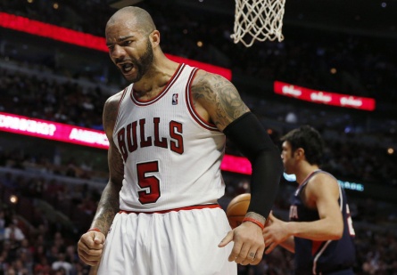 Chicago Bulls' Boozer celebrates a basket against the Atlanta Hawks during the second half of their NBA basketball game in Chicago